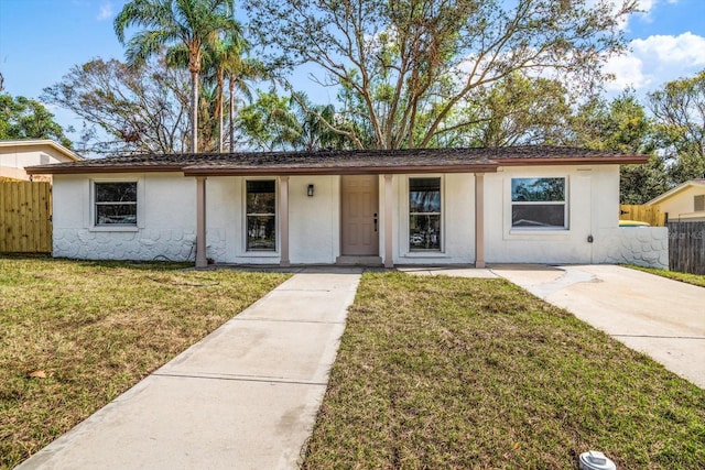 single story home featuring a front yard