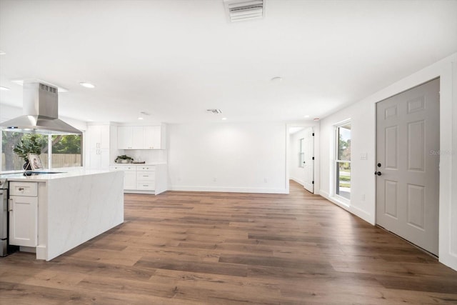 interior space with wood-type flooring and a wealth of natural light