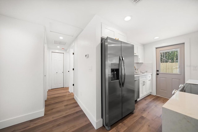 kitchen with stainless steel appliances, dark wood-type flooring, sink, and white cabinets