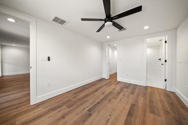 unfurnished bedroom featuring hardwood / wood-style floors and ceiling fan