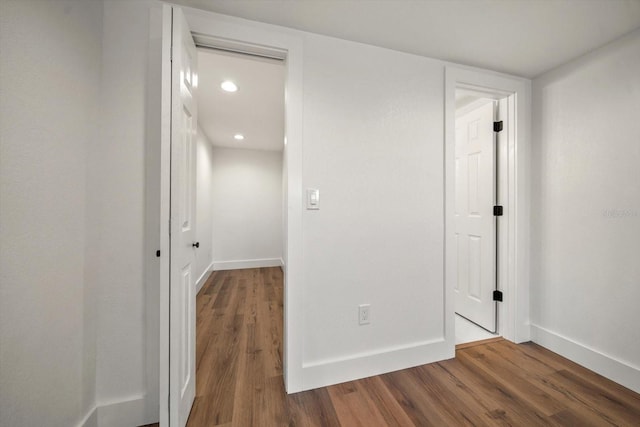 spare room featuring wood-type flooring