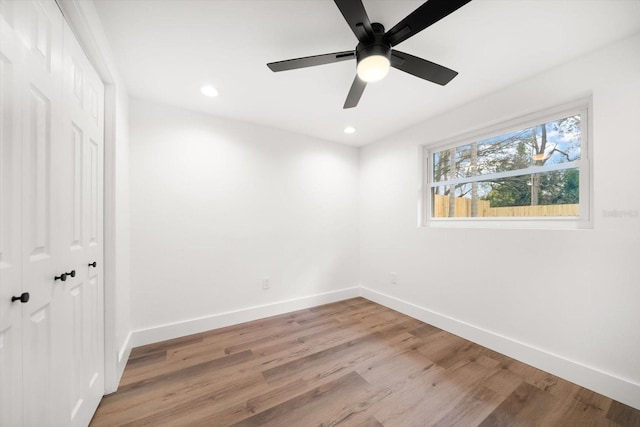 unfurnished bedroom with a closet, ceiling fan, and light wood-type flooring