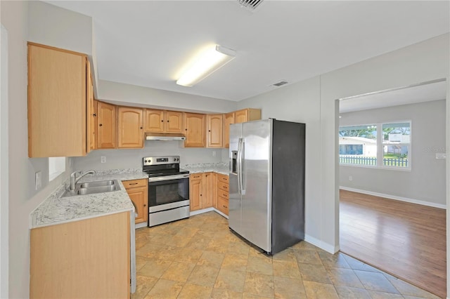 kitchen with visible vents, stainless steel appliances, a sink, light brown cabinets, and under cabinet range hood