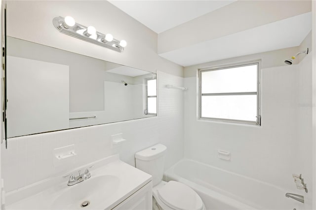 full bathroom featuring vanity, toilet, tile walls, tub / shower combination, and backsplash