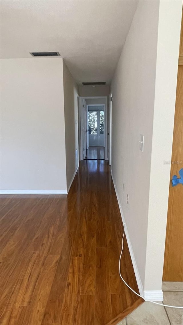 hallway featuring dark wood-type flooring