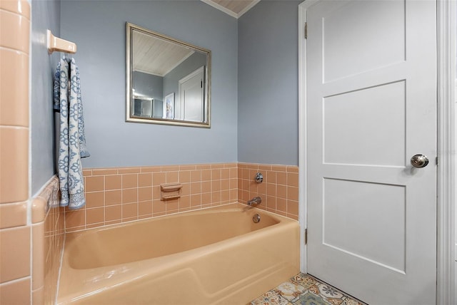 bathroom with a garden tub, tile patterned flooring, and ornamental molding