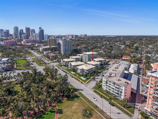 birds eye view of property with a view of city