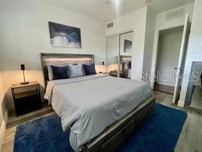 bedroom with a closet and wood finished floors