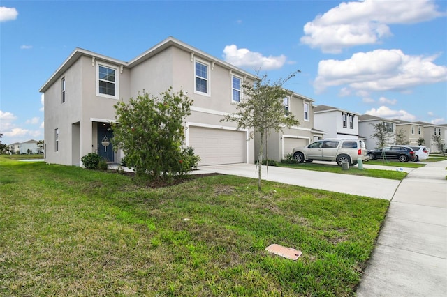 view of front of property with a garage and a front yard