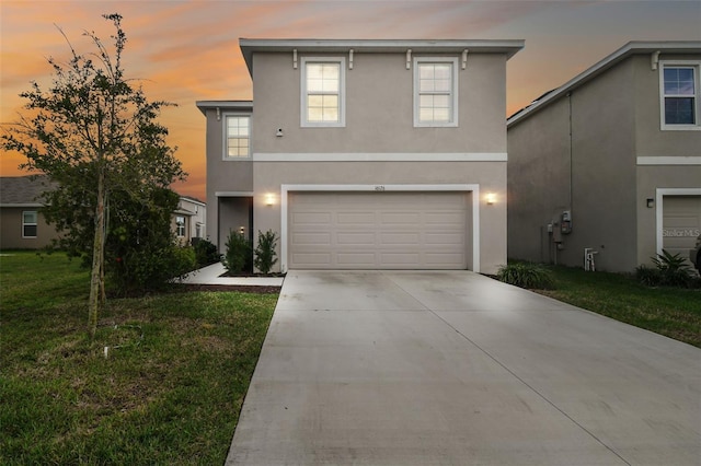 16126 Sunday Stroll Way, Odessa, FL 33556 - view of front facade featuring driveway, stucco siding, a garage, and a front yard