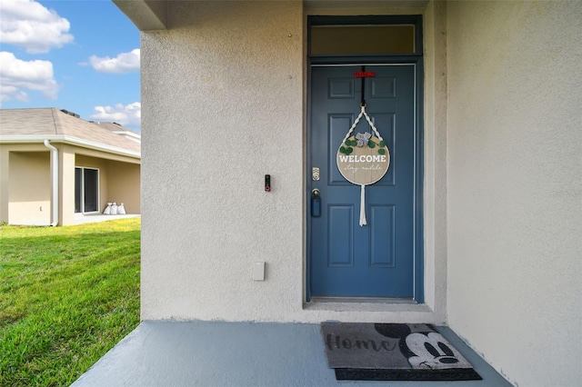 16126 Sunday Stroll Way, Odessa, FL 33556 - view of exterior entry featuring stucco siding and a lawn
