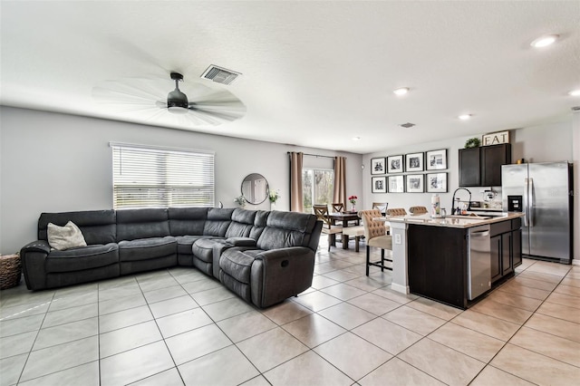 16126 Sunday Stroll Way, Odessa, FL 33556 - living room featuring light tile patterned floors, ceiling fan, and recessed lighting