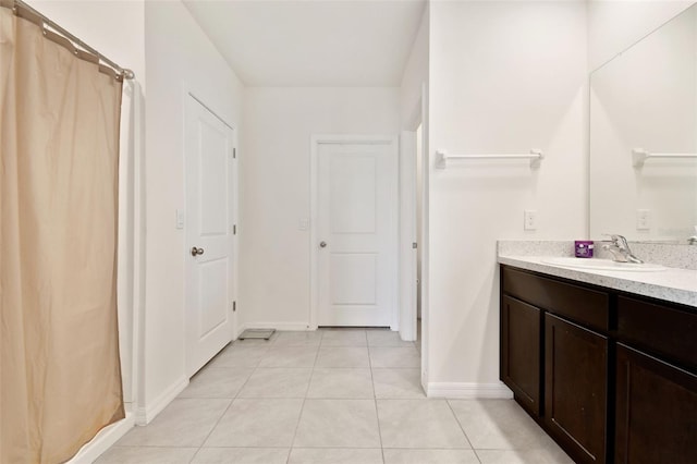 16126 Sunday Stroll Way, Odessa, FL 33556 - bathroom featuring baseboards, tile patterned flooring, and vanity