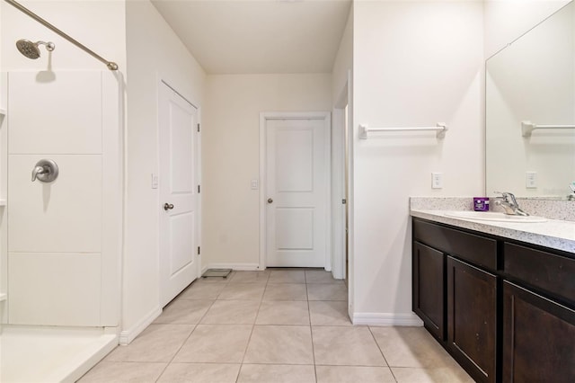 16126 Sunday Stroll Way, Odessa, FL 33556 - bathroom featuring baseboards, a shower, tile patterned floors, and vanity