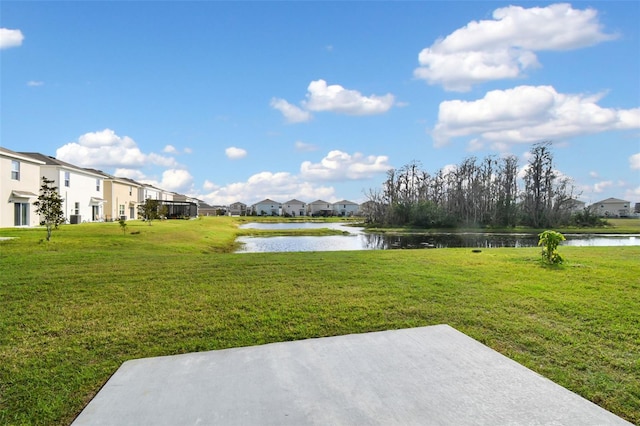 16126 Sunday Stroll Way, Odessa, FL 33556 - view of grassy yard featuring a water view, a residential view, and a patio