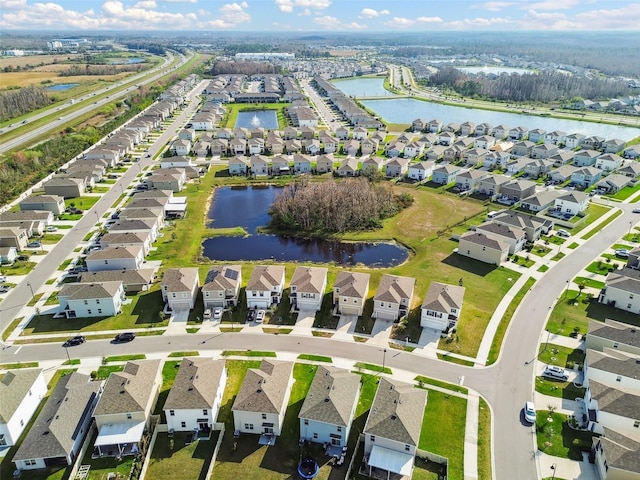 16126 Sunday Stroll Way, Odessa, FL 33556 - aerial view of property and surrounding area featuring a nearby body of water and nearby suburban area