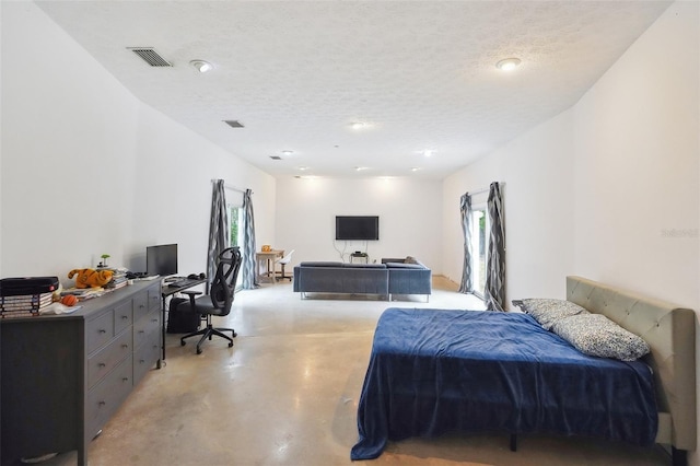 bedroom featuring a textured ceiling