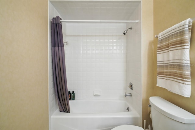 bathroom with shower / bathtub combination with curtain and toilet