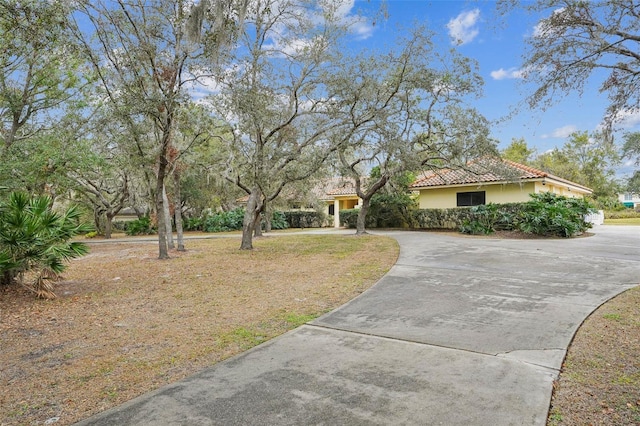 mediterranean / spanish house with a front lawn