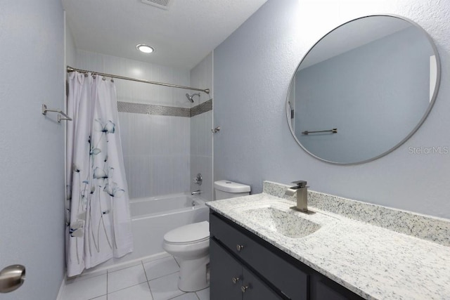 full bathroom featuring shower / tub combo with curtain, vanity, tile patterned flooring, and toilet