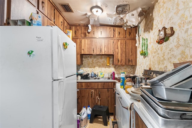 kitchen with white fridge and sink