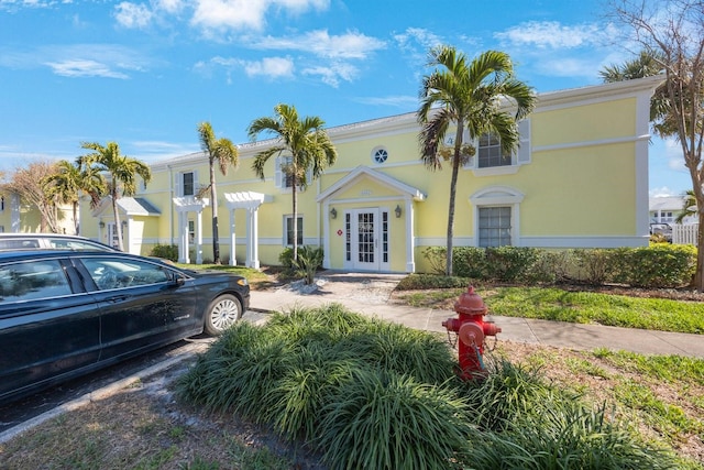 mediterranean / spanish home with french doors