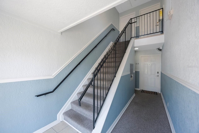 stairs featuring a towering ceiling