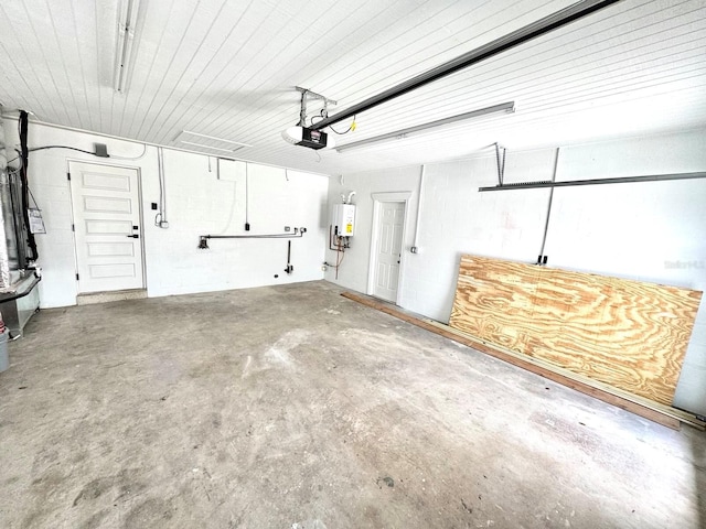 garage with a garage door opener and tankless water heater