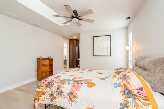 bedroom featuring light hardwood / wood-style flooring and ceiling fan