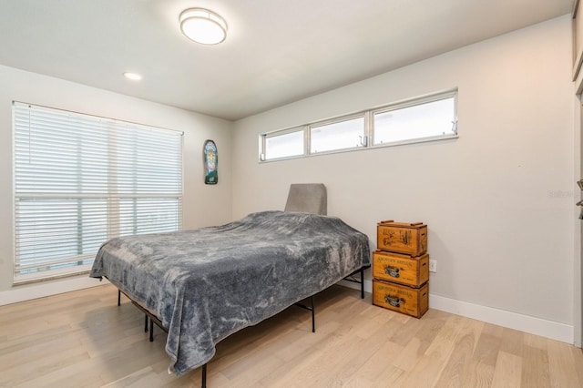 bedroom with light hardwood / wood-style floors