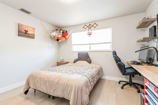 bedroom with light hardwood / wood-style flooring