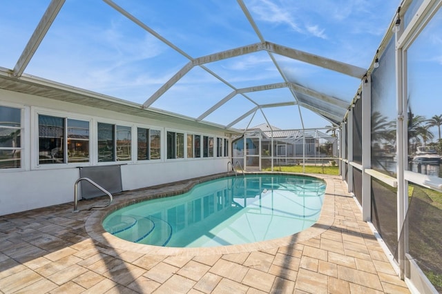 view of pool featuring a patio and a lanai