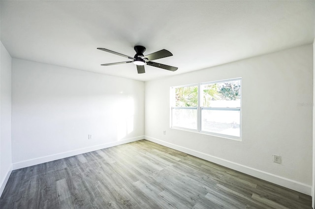 empty room featuring ceiling fan and wood-type flooring