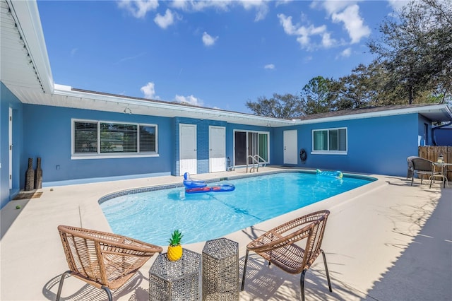 outdoor pool featuring a patio