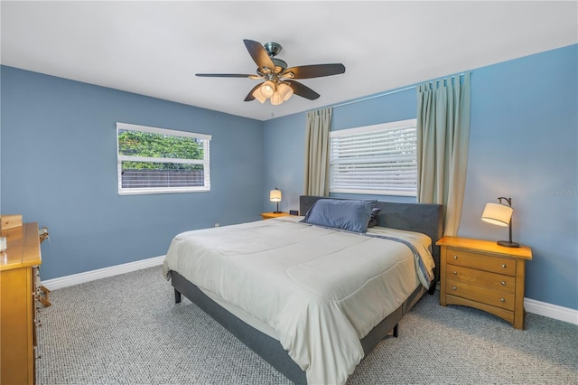 bedroom featuring ceiling fan, carpet, and baseboards