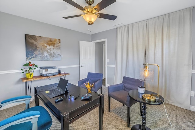 office area with a ceiling fan