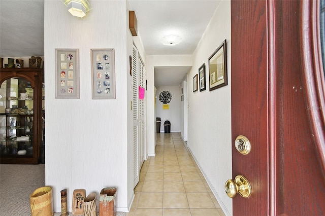 hallway featuring light tile patterned flooring