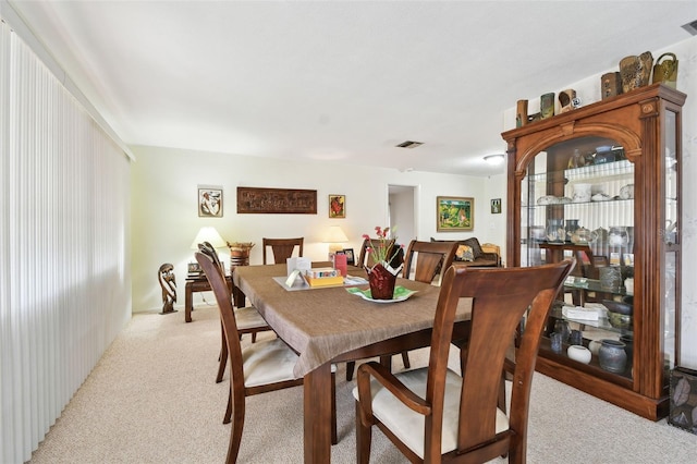 view of carpeted dining space