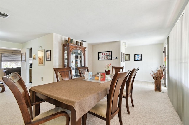 view of carpeted dining space