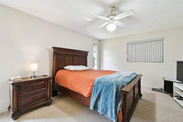 bedroom with ceiling fan and light colored carpet