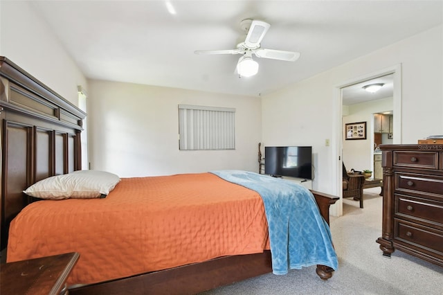 bedroom featuring light colored carpet and ceiling fan