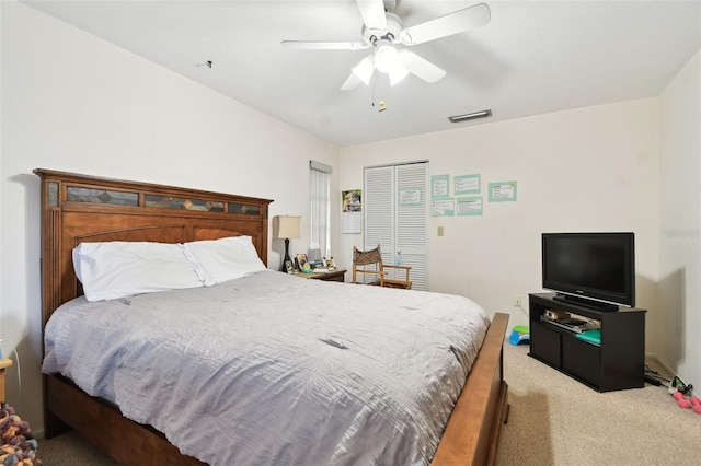 carpeted bedroom with ceiling fan