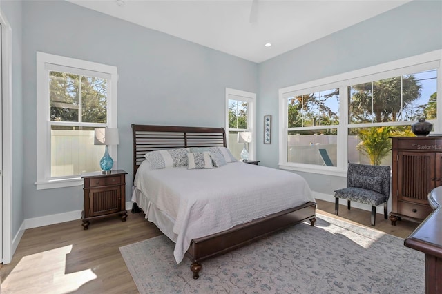 bedroom with wood-type flooring and ceiling fan