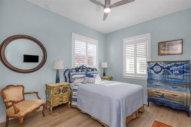 bedroom featuring light hardwood / wood-style flooring and ceiling fan