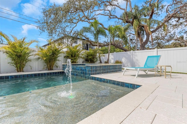 view of swimming pool with a patio area and pool water feature