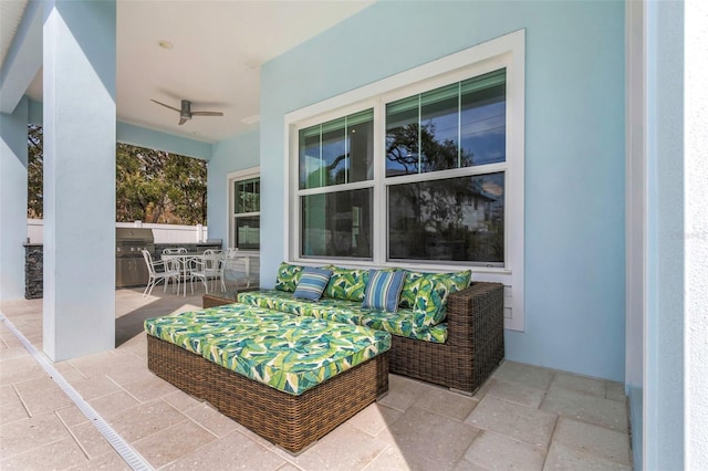 view of patio / terrace featuring an outdoor living space, exterior kitchen, ceiling fan, and a grill