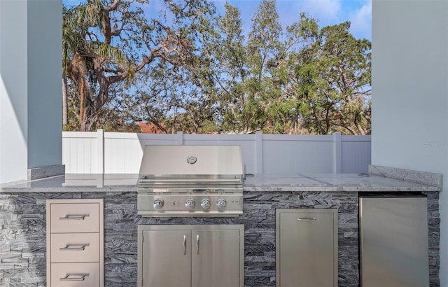 view of patio / terrace featuring exterior kitchen and grilling area