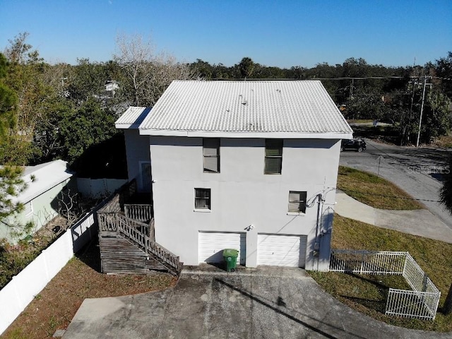 view of side of property featuring a garage