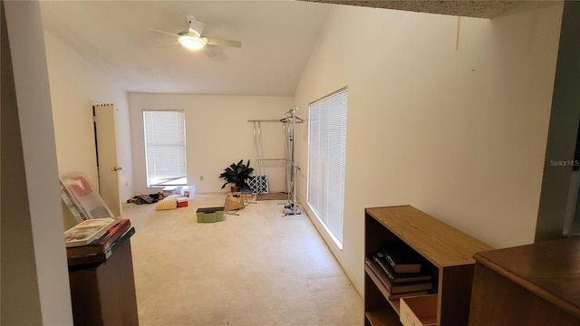 miscellaneous room with light carpet, vaulted ceiling, and ceiling fan