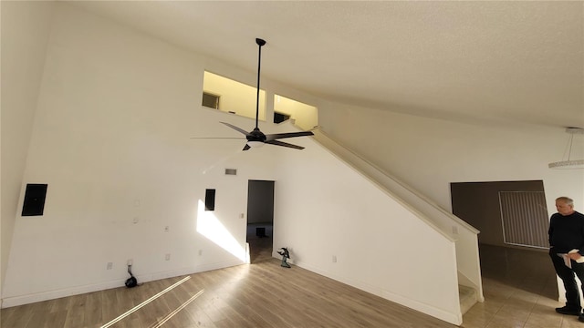 unfurnished living room featuring ceiling fan and hardwood / wood-style floors